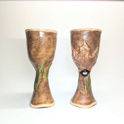 Pair of handcrafted goblets made from chamotte clay, created using molds. Serving as inspiration for Ceramic Island course participants.